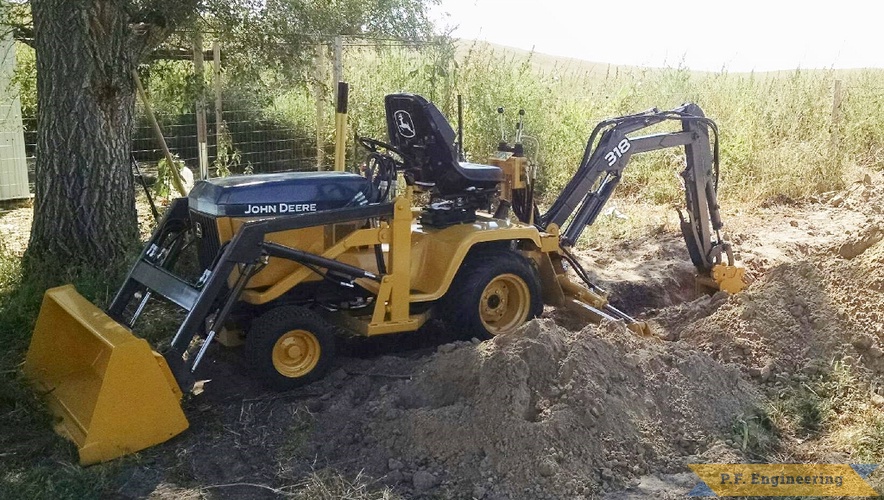 Jake T., John Deere 318 Micro Hoe | John Deere 318 Micro Hoe digging 2 by Jake T.