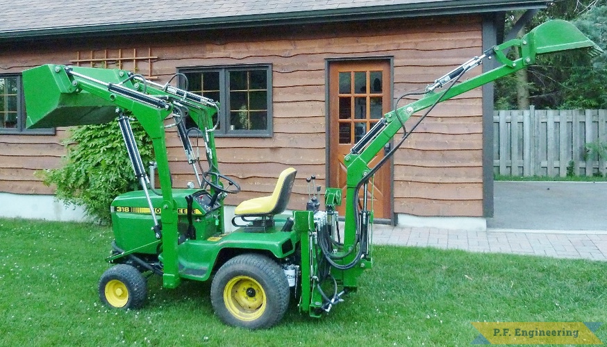 Walter K., Pointe Claire, Quebec. John Deere 318 Micro Hoe and loader | John Deere 318 Micro Hoe Loader side view by Walter K., Pointe Claire, Quebec, CN