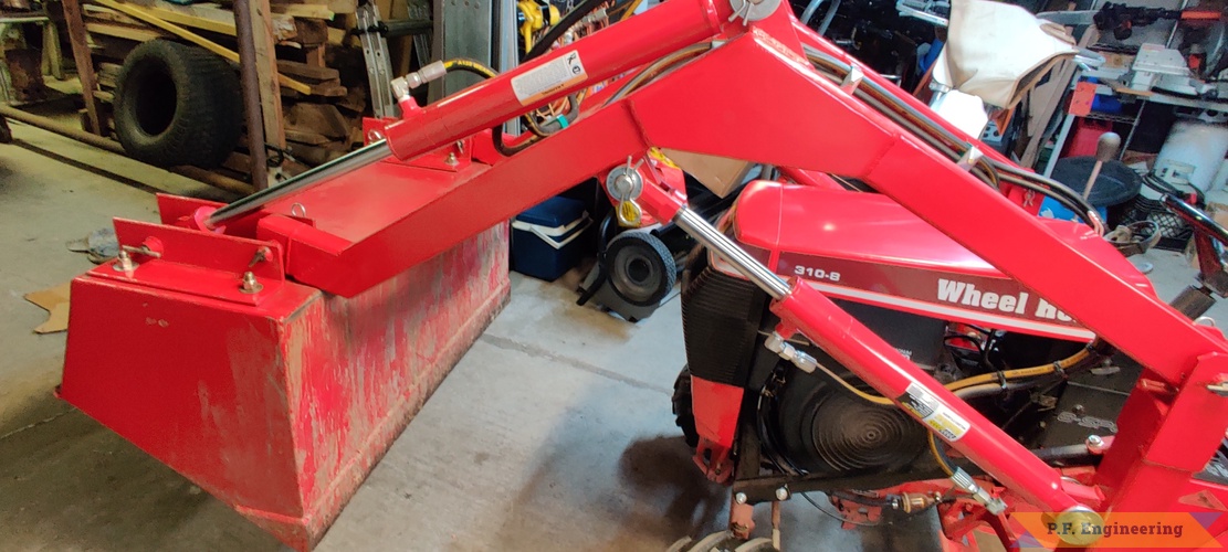 Don A. from Thibodaux, LA and his Wheelhorse 310-8 loader | Don A. and his Wheelhorse 310-8 loader in Thibodaux, LA boom end modification for more bucket curl