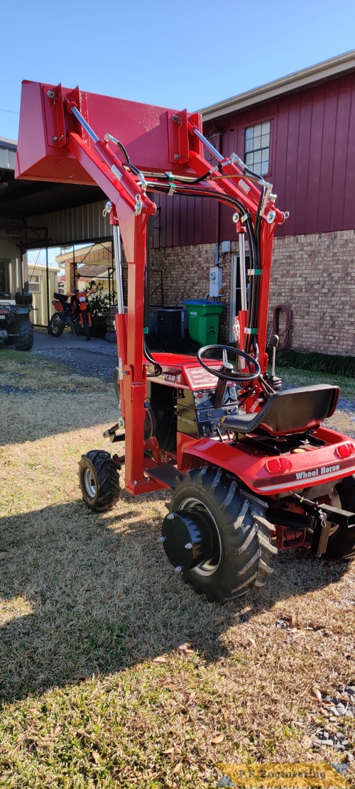 Don A. from Thibodaux, LA and his Wheelhorse 310-8 loader | Don A. and his Wheelhorse 310-8 loader in Thibodaux, LA bucket raised left rear view