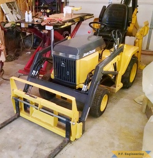 John Deere 318 Micro Hoe Loader with Pallet forks by Jake T.