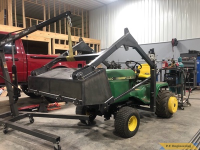 John Deere 420 loader bucket dump