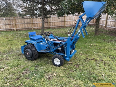 Patrick C. Ford LGT 145 pin-on mini payloader raised bucket